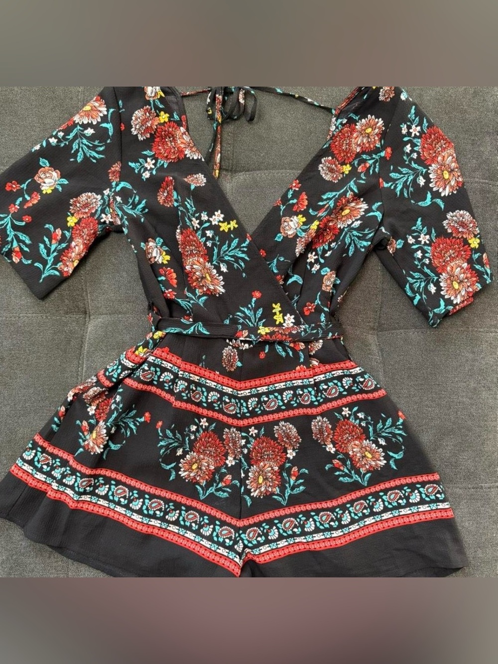 Black Floral Wrap Romper with Red and Teal Blooms